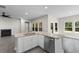 Open kitchen island featuring granite countertops, a sink, stainless appliances, and hardwood floors at 3217 Shadow Pine Ct., Myrtle Beach, SC 29579