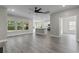 Bright living room featuring wood floors, recessed lighting, and an open kitchen concept at 3217 Shadow Pine Ct., Myrtle Beach, SC 29579