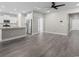Spacious living room featuring wood floors, an open layout, and modern ceiling fan at 3217 Shadow Pine Ct., Myrtle Beach, SC 29579