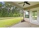 Relaxing screened in back porch with ceiling fan and a view of the back yard at 3217 Shadow Pine Ct., Myrtle Beach, SC 29579