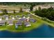 Expansive aerial view showing homes near a tranquil pond in a developing community at 326 Picnic Basket Pl., Longs, SC 29568