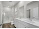 Elegant bathroom with double sink vanity, framed mirrors, and a glass-enclosed shower at 326 Picnic Basket Pl., Longs, SC 29568