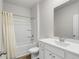 Bright bathroom with a shower-tub combo, vanity, and updated fixtures at 326 Picnic Basket Pl., Longs, SC 29568