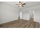 Spacious primary bedroom with hardwood floors and an en-suite bathroom at 326 Picnic Basket Pl., Longs, SC 29568