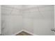 Walk-in closet with white wire shelving and modern wood-look floors at 326 Picnic Basket Pl., Longs, SC 29568