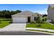 Charming single-story home with a well-manicured lawn and attached two-car garage at 326 Picnic Basket Pl., Longs, SC 29568