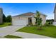 Beautiful home with a manicured lawn, attached garage, and charming curb appeal at 326 Picnic Basket Pl., Longs, SC 29568