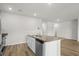 Bright kitchen featuring a granite island with stainless steel dishwasher and sink at 326 Picnic Basket Pl., Longs, SC 29568