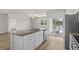 Kitchen island overlooking great room and screened-in porch at 326 Picnic Basket Pl., Longs, SC 29568