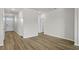 Spacious living area with wood-look floors and neutral paint, offering a blank canvas for personalization at 326 Picnic Basket Pl., Longs, SC 29568