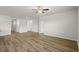 Expansive living room featuring wood-look floors, neutral walls, and multiple doorways for easy flow at 326 Picnic Basket Pl., Longs, SC 29568