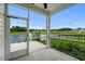 Screened porch with a view of a pond and backyard at 326 Picnic Basket Pl., Longs, SC 29568