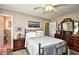 Bedroom with a metal frame bed, hardwood floors, and a decorative dresser with vanity mirror at 3602 Magnolia St. # 3602, Myrtle Beach, SC 29577