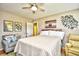 This cozy bedroom features a ceiling fan, comfortable seating, and stylish decor for a relaxing retreat at 3602 Magnolia St. # 3602, Myrtle Beach, SC 29577