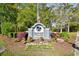 Landscaped entrance to Seagate Village community featuring a palm tree logo and American flag at 3602 Magnolia St. # 3602, Myrtle Beach, SC 29577