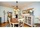 Charming dining area with wood floors, decorative mirrors, and elegant chandelier at 3602 Magnolia St. # 3602, Myrtle Beach, SC 29577