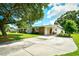 Attractive brick home features a well-kept lawn, mature tree, and a covered carport at 3602 Magnolia St. # 3602, Myrtle Beach, SC 29577