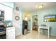 Bright kitchen with white cabinets and adjacent breakfast table for casual dining at 3602 Magnolia St. # 3602, Myrtle Beach, SC 29577
