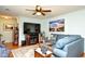 Spacious living room with a TV, sofa, area rug, and adjacent dining area at 3602 Magnolia St. # 3602, Myrtle Beach, SC 29577