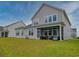 Expansive backyard and covered patio, perfect for outdoor living and entertaining at 376 Mikita Dr., Surfside Beach, SC 29575