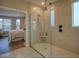 Modern bathroom featuring a frameless glass shower with bronze fixtures and a tiled shampoo niche at 376 Mikita Dr., Surfside Beach, SC 29575