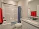 Bathroom with a granite vanity top, single sink, and shower-tub combination at 376 Mikita Dr., Surfside Beach, SC 29575