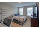 Bedroom with two windows and a bed with a patterned comforter at 376 Mikita Dr., Surfside Beach, SC 29575