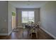 Bright dining nook with charming round table and chairs, next to door to the outside at 376 Mikita Dr., Surfside Beach, SC 29575