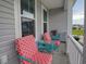 Cozy front porch features inviting patio furniture and great natural light through large windows at 376 Mikita Dr., Surfside Beach, SC 29575