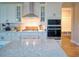 Stylish kitchen featuring granite countertops, subway tile backsplash, modern appliances, and ample cabinet space at 376 Mikita Dr., Surfside Beach, SC 29575
