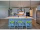Modern kitchen island featuring granite countertops, pendant lighting, and barstool seating at 376 Mikita Dr., Surfside Beach, SC 29575