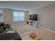 Spacious living room with carpet, TV, and minimal decor at 376 Mikita Dr., Surfside Beach, SC 29575