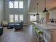 Bright living space combines modern kitchen island, dining area, cozy living room, and high ceilings at 376 Mikita Dr., Surfside Beach, SC 29575
