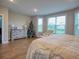 Spacious main bedroom with a bay window, dresser, and chair at 376 Mikita Dr., Surfside Beach, SC 29575