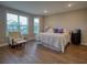 Bright main bedroom featuring large windows, sitting area, and dark wood floors at 376 Mikita Dr., Surfside Beach, SC 29575