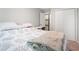Cozy bedroom with neutral walls, a comfortable bed and a door leading to the bathroom at 403 71St Ave. N # 5, Myrtle Beach, SC 29572