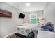 Modern bedroom with a TV, window, desk, and a comfortable workspace with plenty of natural light at 403 71St Ave. N # 5, Myrtle Beach, SC 29572
