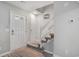 Inviting entryway with a front door, staircase, and wood-look flooring, creating a welcoming space at 403 71St Ave. N # 5, Myrtle Beach, SC 29572