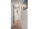 Hallway with a sliding barn door, neutral walls, and plush carpeting, creating a cozy walkway at 403 71St Ave. N # 5, Myrtle Beach, SC 29572