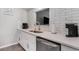 Bright kitchen area featuring stainless steel sink and appliances set in white cabinetry at 403 71St Ave. N # 5, Myrtle Beach, SC 29572