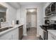 Bright kitchen featuring stainless steel appliances, white cabinets, and stylish subway tile backsplash at 403 71St Ave. N # 5, Myrtle Beach, SC 29572