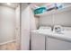 Functional laundry room with a washing machine, dryer, shelving, and ample storage space at 403 71St Ave. N # 5, Myrtle Beach, SC 29572