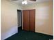 Bedroom features a standard closet, neutral paint, and green carpet at 4041 Long Line Ln., Myrtle Beach, SC 29579