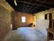 Bright garage interior showcasing concrete floors and wooden paneling along the walls at 4041 Long Line Ln., Myrtle Beach, SC 29579
