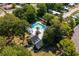 Aerial view of a secluded home featuring a pool, gazebo and deck surrounded by mature trees at 4115 Little River Rd. # 1-E, Myrtle Beach, SC 29577