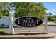 Elegant community sign for Longleaf Place, set amidst lush landscaping, offering a warm welcome at 4115 Little River Rd. # 1-E, Myrtle Beach, SC 29577