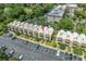 Aerial view showcases a condominium building with parking and manicured landscaping at 4701 N Kings Hwy. # 8, Myrtle Beach, SC 29577