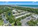 Overhead shot of a condominium complex with parking surrounded by trees and a waterway at 4701 N Kings Hwy. # 8, Myrtle Beach, SC 29577