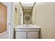 Cozy bathroom with white vanity, an oval mirror, and classic hardware at 4701 N Kings Hwy. # 8, Myrtle Beach, SC 29577