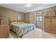 Bedroom featuring textured walls, balcony access, and a comfortable bed at 4701 N Kings Hwy. # 8, Myrtle Beach, SC 29577